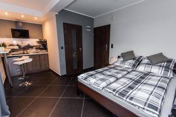 Фото номера Люкс с террасой Апартаменты Apartamenty Dawna Wisła г. Висла 2